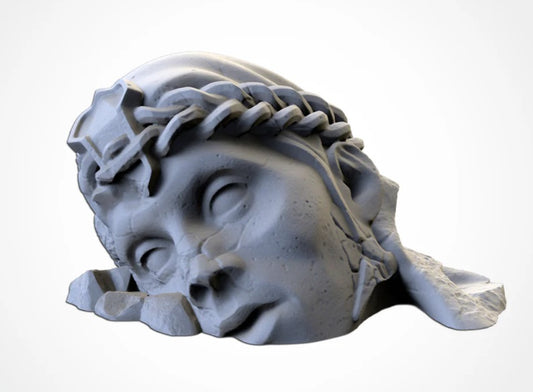 Destroyed female statue head